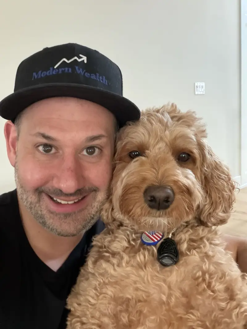 Alan Rhode with his Goldendoodle, Enzo