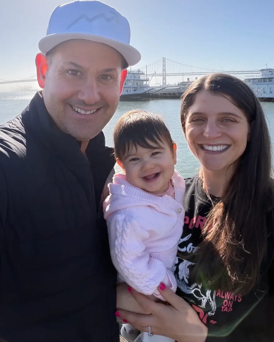 Alan Rhode with his wife Jamie and their daughter